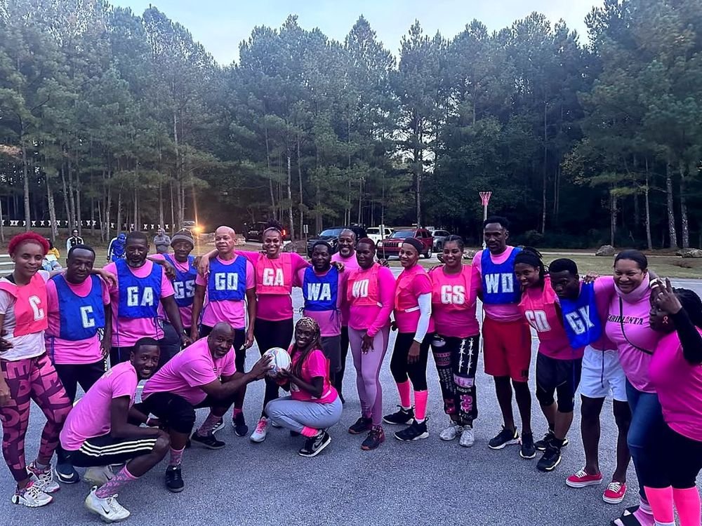 Cariblanta netball players in pink and blue bibs